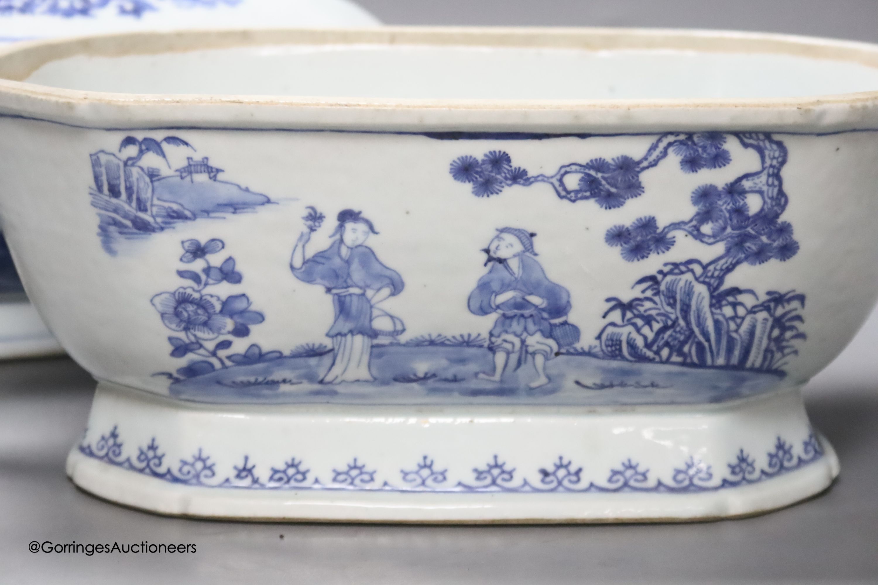 Two 18th century Chinese export blue and white lidded tureens, one lacking cover, 34cm
